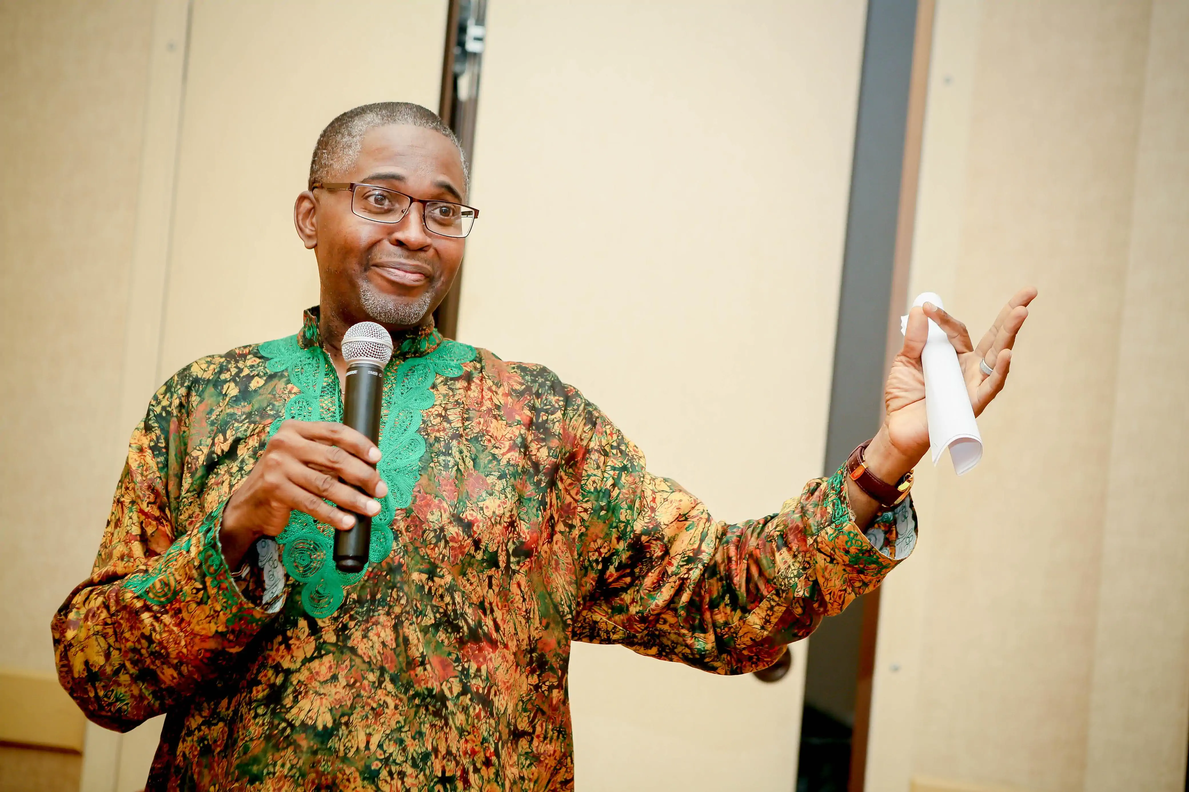 Chike speaking with traditional mic